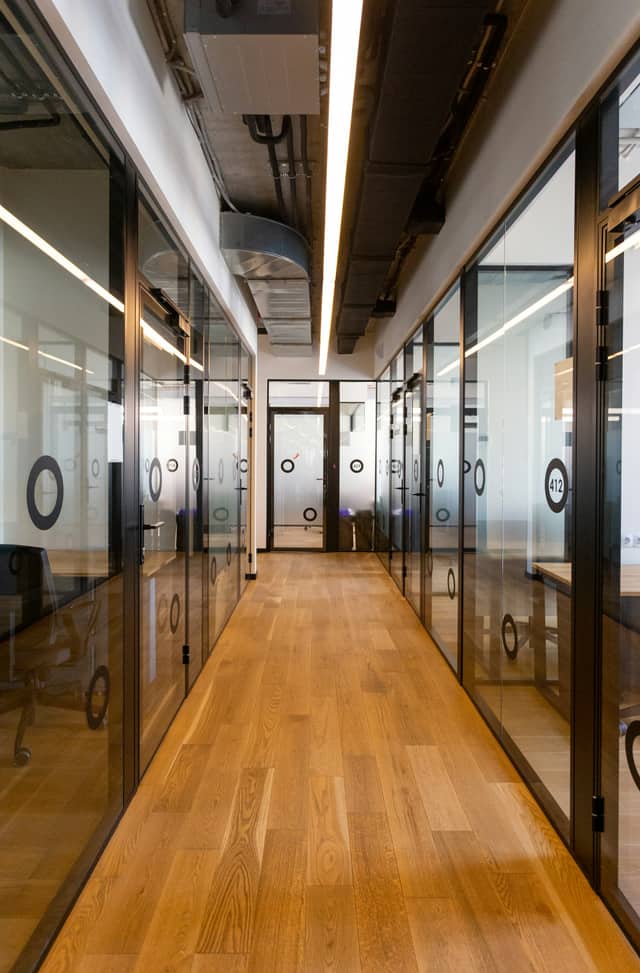 Hardwood floor running the length of a commercial hallway
