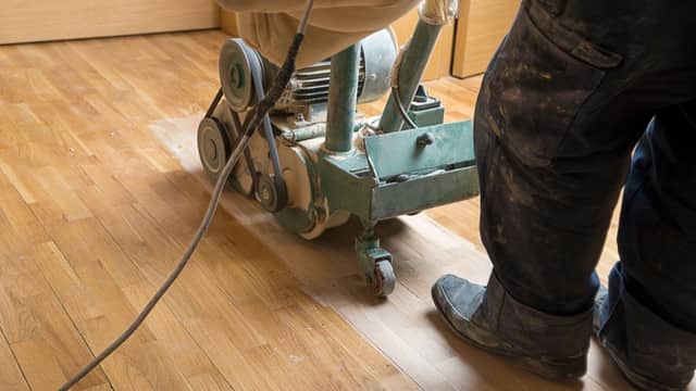 Sanding a hardwood floor during refinishing