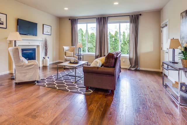 Warm hardwood flooring across an open living room